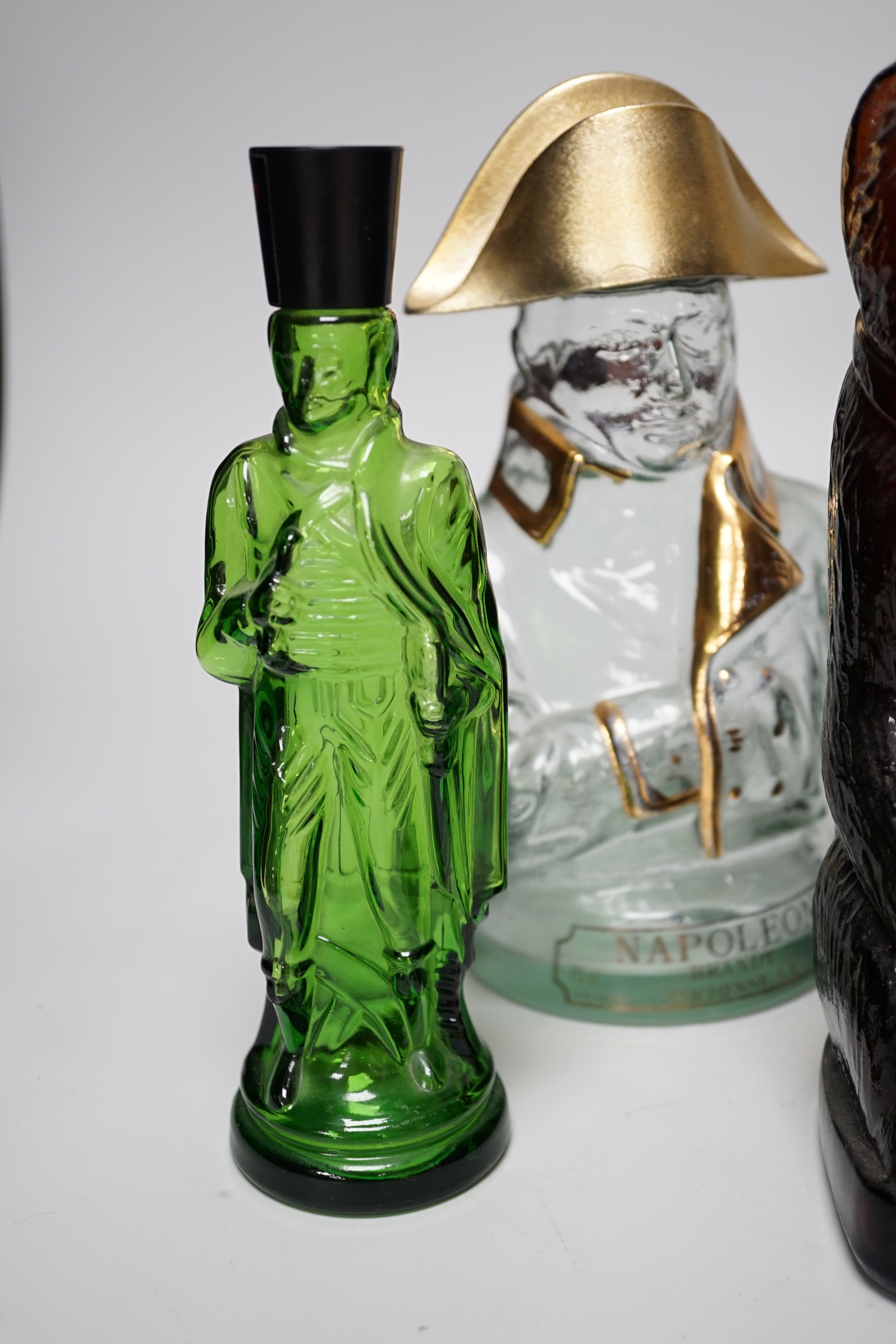Five novelty empty flasks including Napoleon brandy and Cossack vodka